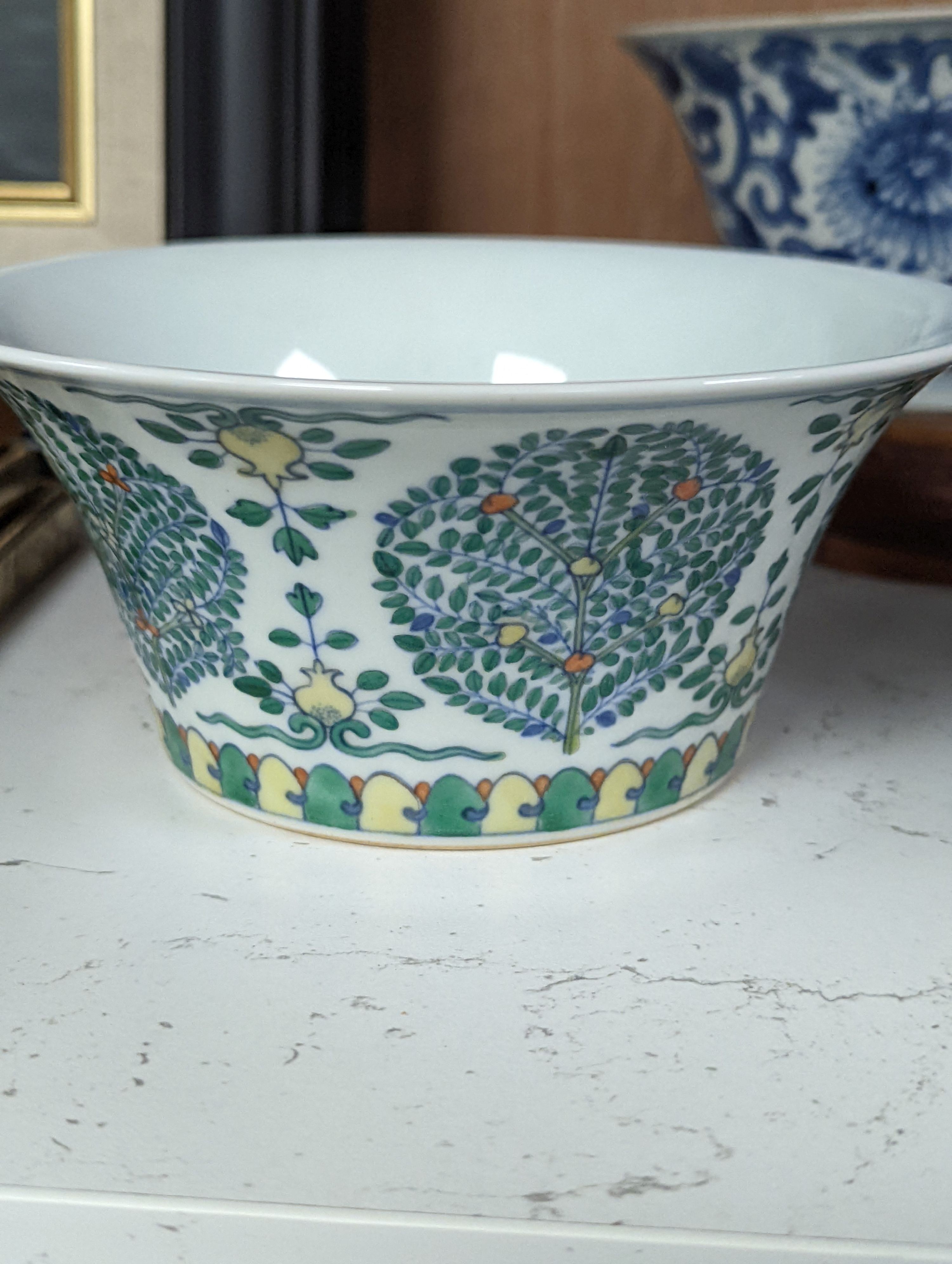 A Chinese blue and white bowl, Kangxi, 15cm. diam., a famille rose teapot stand, Yongzheng, and two doucai bowls